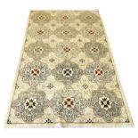 FINE FEREGAN RUG, 198cm x 122cm, rows of oriental medallions on an ivory field.