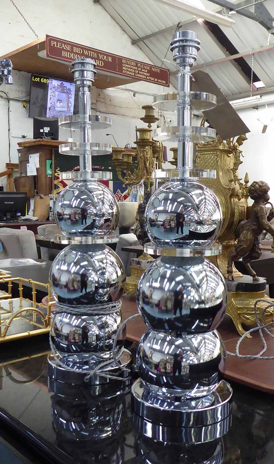 LAMPS, a pair, polished metal balls, each 62cm H.