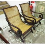 EASY OPEN ARMCHAIRS, a pair, Colonial style caned with scrolled arms, 68cm W x 86cm H.