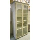 BOOKCASE, 19th century continental vintage, grey painted with two glazed doors and shelves,