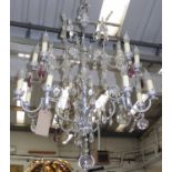 CHANDELIER, fourteen branched in a metal frame with glass drops, 121cm H plus chain.