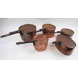 FIVE COPPER PANS, of various sizes, all with lids and iron handles, largest 24cm diam.