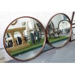 LOOKING GLASSES, a pair, coppered finish frames with circular plates, 92cm D.