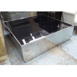 LOW TABLE, with black glass top on a chromed metal frame, 110cm x 110cm x 34cm H.