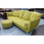 SOFA, four seater, in a lime fabric with six scatter cushions on metal supports,