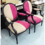 OPEN ARMCHAIRS, a pair, French style, in pink and beige fabric, on an ornate ebonised frame, 63cm W.