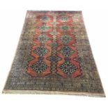 TURKISH RUG, 202cm x 133cm, Baluch design with rows of medallions within multiple geometric borders.