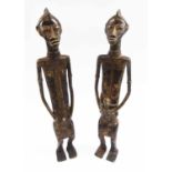 TRIBAL ARTS - LOBI BRONZE FIGURAL SCULPTURES, male and female, Burkina Faso, 41cm H.