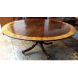 BREAKFAST TABLE, Georgian style mahogany and satinwood crossbanded on outswept supports,