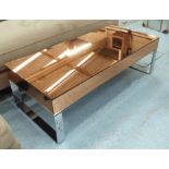 MIRRORED LOW TABLE, in a coppered finish on metal supports, 130cm x 61cm x 40cm H.