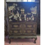 CABINET ON STAND, Chinese black lacquer and soapstone decorated, of two doors above four drawers,