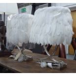TABLE LAMPS, a pair, twin branch, chromed metal base and white feathered shades, 62cm H.