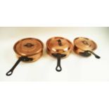 VARIOUS LIDDED COPPER PANS, a set of three, iron handles, largest 25cm diam.