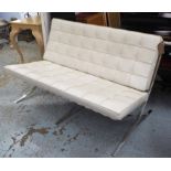 SOFA, contemporary style, with white upholstery, on polished metal base, 220cm W x 80cm D x 83cm H.