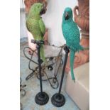 PARROTS ON PERCHES, a stylised duo, 120cm H.