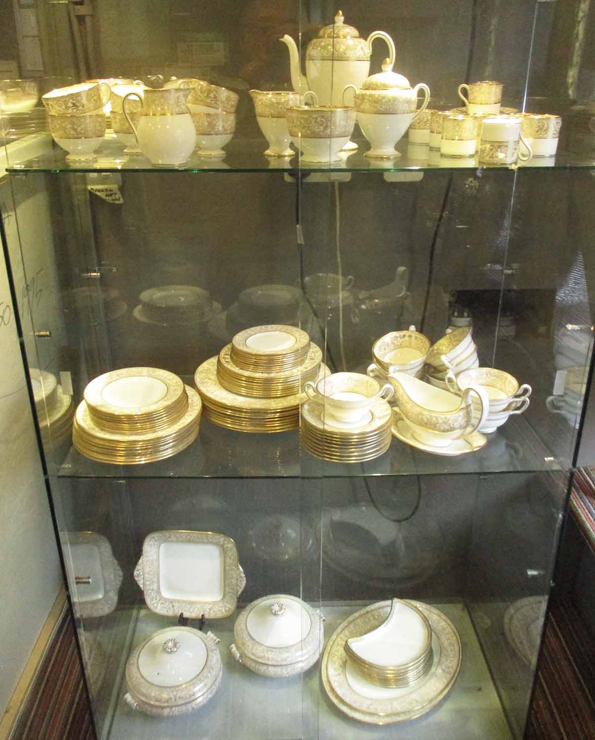 WEDGWOOD 'GOLD FLORENTINE' DINNER SERVICE, nine plate setting including tea and coffee wares,