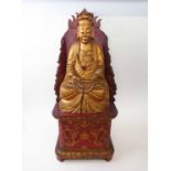 BUDDHA, carved and gilt wood, 51cm H, seated on a red lacquer dais.