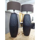 TABLE LAMPS, a pair, contemporary ebonised wood bases, with umber shades, 110cm H.