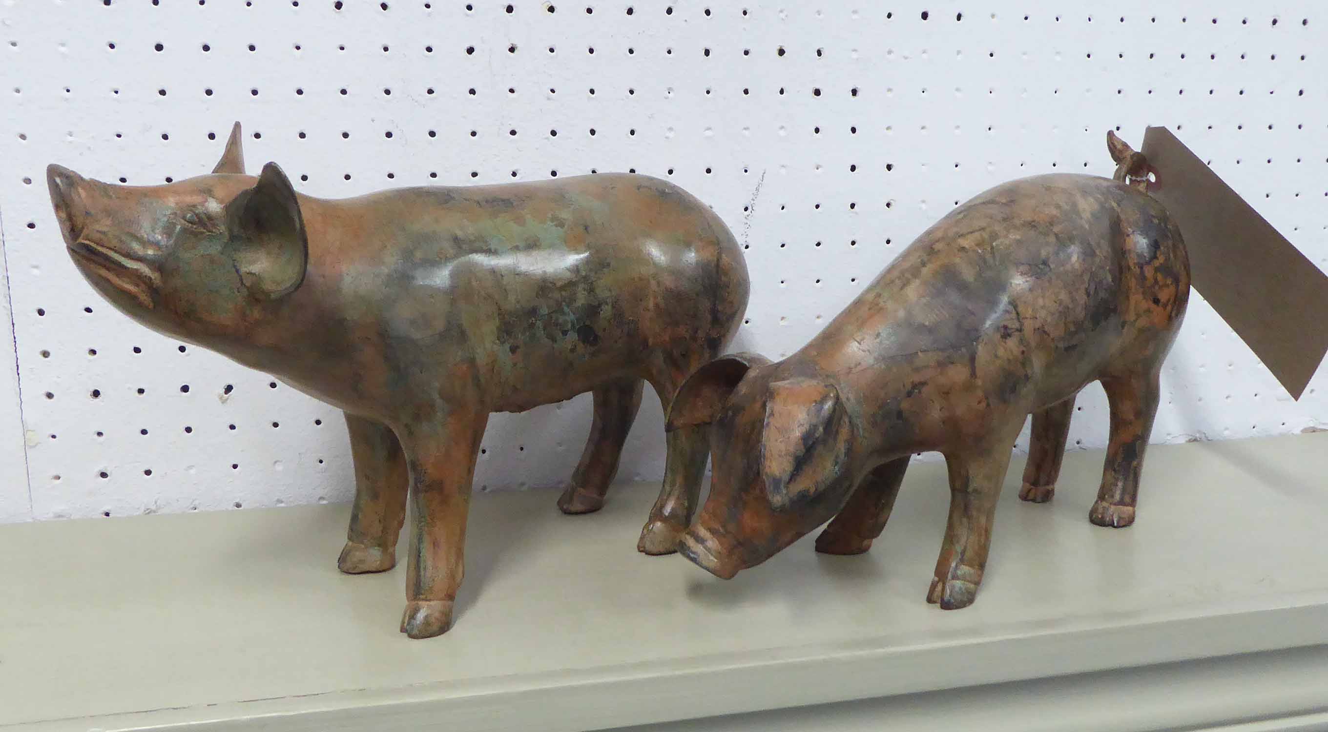 BRONZE PIGS, a pair, by P. Chenet, 29cm L.