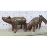 BRONZE PIGS, a pair, by P. Chenet, 29cm L.