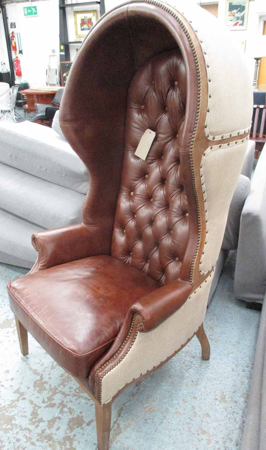 PORTER'S CHAIR, continental style, with a buttoned leather interior and linen style exterior,