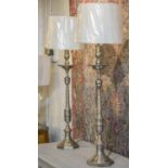 CANDLESTICK LAMPS, a pair, silver plated of candlestick form, with shades, 85cm H excluding shades.