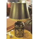 TOLEWARE TABLE LAMP, with central coat of arms decoration and a shade, 71cm H.