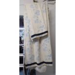 CURTAINS, a pair, with blue foliate detail and navy trim, lined and interlined, 125cm x 270cm drop.