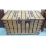 STRONG BOX, Colonial style iron bound teak with internal compartments, 127cm x 66cm x 75cm.