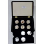 CASED COIN COLLECTION OF 8 SILVER PROOF COINS