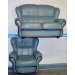 2 PIECE MODERN GREEN LEATHER LOUNGE SUITE WITH WOOD TRIM COMPRISING 2 SEATER SETTEE & SINGLE ARM