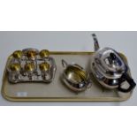 TRAY CONTAINING ORNATE EPNS EGG CUP SET ON STAND & PART EPNS TEA SERVICE