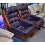 PAIR OF VINTAGE TEAK FRAMED LEATHER EASY CHAIRS