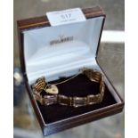 9 CARAT GOLD GATE BRACELET WITH HEART SHAPED CLASP - APPROXIMATE WEIGHT = 12.2 GRAMS