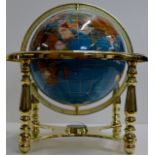 A GEM INLAID WORLD GLOBE ON ADJUSTABLE GILT STAND