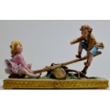 A LARGE CAPODIMONTE PORCELAIN CENTREPIECE DISPLAY - A YOUNG BOY & GIRL ON A SEE-SAW