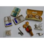 BOX WITH ASSORTED COLLECTABLES, SAXOPHONE BROOCH, PLAYING CARDS, BOTTLE STOPPER, WHISTLE, SPECTACLES