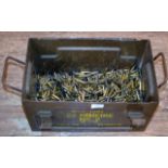 A METAL DOUBLE HANDLED AMMUNITION CRATE WITH A LARGE QUANTITY OF SPENT L2A2 BULLET CASINGS