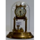 AN OLD BRASS MANTLE CLOCK WITH WHITE ENAMEL DIAL & GLASS DOME COVER