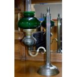 AN UNUSUAL SIDE ARM PARAFFIN LAMP WITH GREEN GLASS SHADE & GLASS FUNNEL