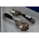 PAIR OF ORNATE EASTERN WHITE METAL HORN HANDLED SERVERS