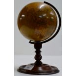 AN OLD NEWTON'S 9¾" TERRESTRIAL WORLD GLOBE ON TURNED MAHOGANY STAND