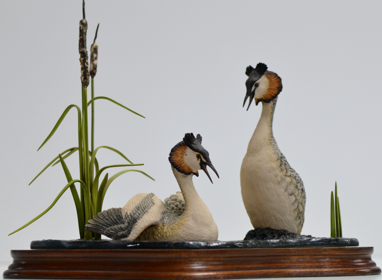 A LARGE BORDER FINE ARTS BIRD GROUP, ON WOODEN STAND, BY AYRES