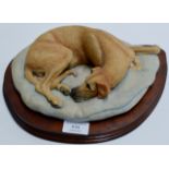 A LARGE BORDER FINE ARTS DOG ORNAMENT ON WOODEN STAND, BY E. WAUGH