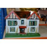 A DOLLS HOUSE WITH ASSORTED FURNITURE