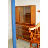 2 TEAK GLASS FRONTED BOOKCASES