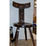 AN ARTS & CRAFTS OAK SPINNING CHAIR WITH COPPER GLASGOW ROSE DESIGN DECORATION IN RELIEF