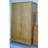 A MODERN OAK DOUBLE DOOR WARDROBE WITH UNDER DRAWERS