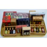 A TRAY WITH A COLLECTION OF VARIOUS BOXED ALCOHOL MINIATURES