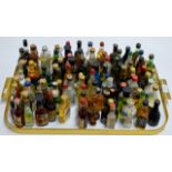 A TRAY WITH 100 VARIOUS ALCOHOL MINIATURES